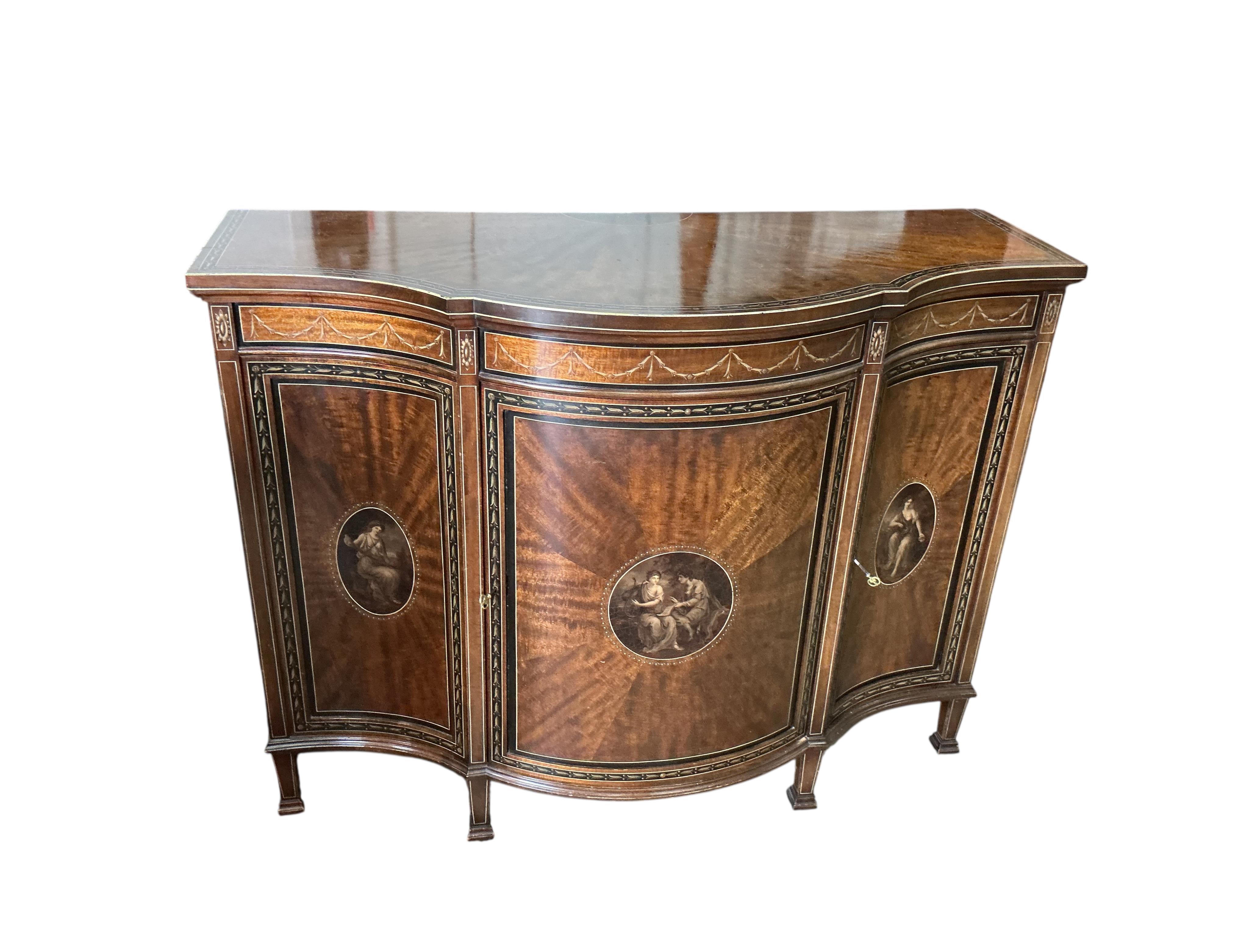 An Edwardian Sheraton Revival painted mahogany bowfront side cabinet